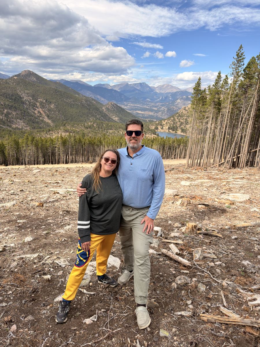 Matt and Shawna with the Rocky Mountain National Park vista behind them