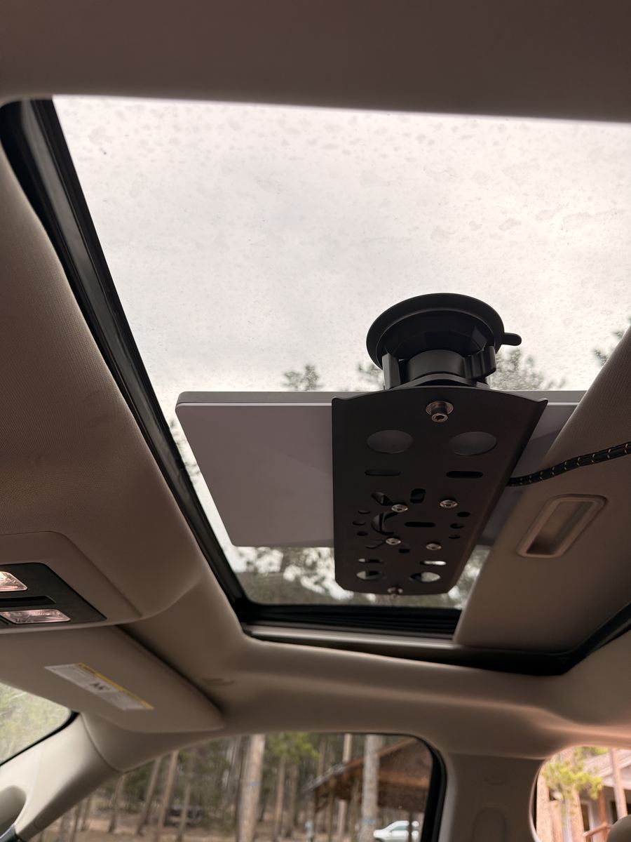 Starlink dish suction-mounted to the truck's sunroof