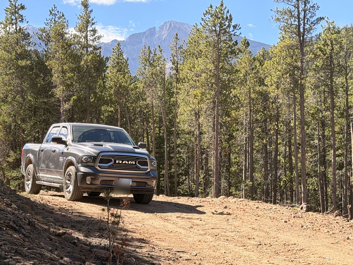 The truck with Longs Peak rising behind it